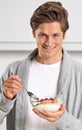 Smile, portrait and man with cereal in kitchen of home for hydration, health and wellness. Happy, confident and young Royalty Free Stock Photo