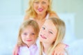 Smile, portrait and mother with children on bed for bonding, relaxing and spending time together. Happy, love and young Royalty Free Stock Photo