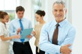 Smile, portrait and senior businessman with team of people in the office with positive, good and confident attitude Royalty Free Stock Photo