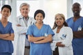 Smile, portrait and team of doctors with arms crossed standing together in hospital. Face, confident or medical Royalty Free Stock Photo