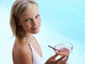 Smile, portrait and woman at pool with cocktail, sunshine and travel for summer holiday at hotel. Relax, water and face Royalty Free Stock Photo