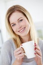 Smile, relax and portrait of woman with coffee in a kitchen, calm and content in her home. Happy, face and female Royalty Free Stock Photo