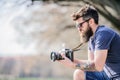 Smile. retro photographic equipment. brutal photographer with camera. photo of nature. reporter or journalist. hipster Royalty Free Stock Photo