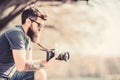 Smile. retro photographic equipment. brutal photographer with camera. photo of nature. reporter or journalist. hipster Royalty Free Stock Photo