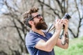 Smile. retro photographic equipment. brutal photographer with camera. photo of nature. reporter or journalist. hipster Royalty Free Stock Photo