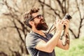 Smile. retro photographic equipment. brutal photographer with camera. photo of nature. reporter or journalist. hipster Royalty Free Stock Photo
