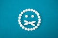 Smile round pills on a blue background