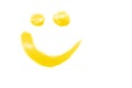 Smile shape - cosmetic sample isolated on white. Trendy yellow color of the year 2021 - Illuminating