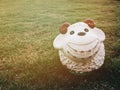 Smile of sheep doll stucco on grass Royalty Free Stock Photo