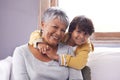 Smile, sofa and portrait of grandmother with kid for love, support and childhood development at home Relax, elderly Royalty Free Stock Photo