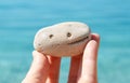 Smile on the stone. Happy holidays on the beach.