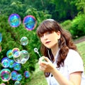 Smile teen with soap bubbles