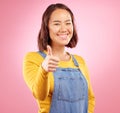 Smile, thumbs up and yes with portrait of woman in studio for support, agreement and motivation. Winner, emoji and