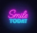 Smile Today neon lettering on brick wall background.