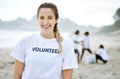 Smile, volunteer portrait and woman at beach for cleaning, recycling or environmental sustainability. Earth day, happy