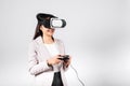 Smile woman confidence excited wear 3D VR headset device and playing game virtual reality experience with joystick isolated Royalty Free Stock Photo