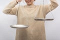 Smile woman is holding the empty scales. Equilibrium, justice concept Royalty Free Stock Photo