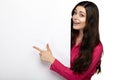 Smile woman standing pointing her finger at board Royalty Free Stock Photo