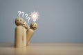 Smile wooden miniature figure outstanding from line with glowing lightbulb for creative thinking idea and problem solving Royalty Free Stock Photo