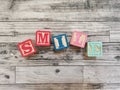 Smile. Smile word from wooden letter blocks Royalty Free Stock Photo