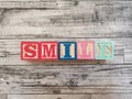Smile. Smile word from wooden letter blocks Royalty Free Stock Photo