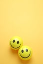 Smile yellow balloon.Toy ball on yellowbackground.