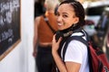 Smile, you never know whore inspiring. a young woman walking through the city. Royalty Free Stock Photo