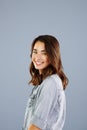 Smile because youre worth it. Studio portrait of an attractive young woman posing against a grey background.