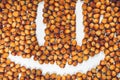 Smiled face from many hazel nuts Royalty Free Stock Photo