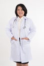 Smiled kindness asian female doctor standing isolated on white background Royalty Free Stock Photo