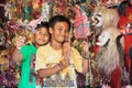Smiley Balinese children play with shadow puppets