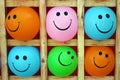 Smiley balls. Group of emotional balls: happy smiley on yellow, pink ,green, blue and orange ball.