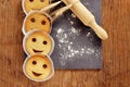 Smiley biscuits on a wooden rustic table Royalty Free Stock Photo