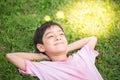 Smiley boy laying down in the park Royalty Free Stock Photo