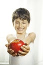 Smiley boy with red apple Royalty Free Stock Photo