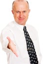 Smiley business man ready for a hand shake Royalty Free Stock Photo