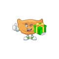 Smiley cornes de gazelle cartoon character holding a gift box