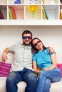 Smiley couple in stereo glasses