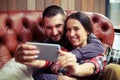 Smiley couple taking selfie picture