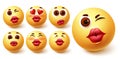 Smiley emoji kiss vector set. Emoji girl face with kissable lips in different facial expression Royalty Free Stock Photo