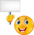 Smiley emoticon holding a blank sign Royalty Free Stock Photo