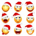 Smiley,emoticon set. Yellow face with emotions and Christmas hat. New Year Santa.Winter emoji. Sad happy angry faces Royalty Free Stock Photo