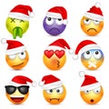 Smiley emoticon set. Yellow face with emotions and Christmas hat. New Year Santa.Winter emoji. Sad,happy,angry faces Royalty Free Stock Photo