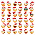 Smiley emoticon set. Yellow face with emotions and Christmas hat. New Year Santa.Winter emoji. Sad,happy,angry faces Royalty Free Stock Photo