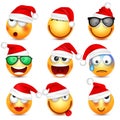 Smiley,emoticon set. Yellow face with emotions and Christmas hat. New Year Santa.Winter emoji. Sad happy angry faces Royalty Free Stock Photo