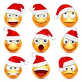 Smiley,emoticon set. Yellow face with emotions and Christmas hat. New Year Santa.Winter emoji. Sad happy angry faces Royalty Free Stock Photo