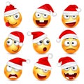 Smiley,emoticon set. Yellow face with emotions and Christmas hat. New Year Santa.Winter emoji. Sad happy angry faces Royalty Free Stock Photo