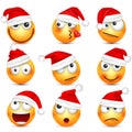 Smiley,emoticon set. Yellow face with emotions and Christmas hat. New Year Santa.Winter emoji. Sad happy angry faces Royalty Free Stock Photo