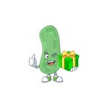 Smiley enterobacteriaceae cartoon character holding a gift box