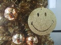 Smiley face with balls on the Christmas tree on the lift side